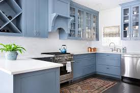 Transitional kitchen designers often select shaker style cabinets because they help to create the transition between traditional and modern kitchen elements. Blue Shaker Kitchen Cabinets With White Octagon Backsplash Tiles Transitional Kitchen