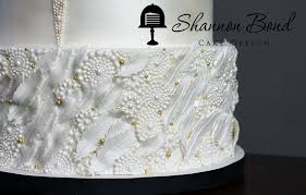 I used waferpaper for feathers and the flower, isomalt for the broche. Gatsby Wedding Cake Cakecentral Com