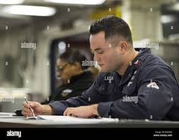ARABIAN SEA (Jan. 19, 2017) Machinist's Mate 1st Class Kalani Lasua, from  Carlsbad, Calif., takes the annual chief petty officer exam