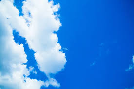 Blue sky with clouds and sun. White clouds in blue sky — Stock Photo ©  ewastudio #25901527
