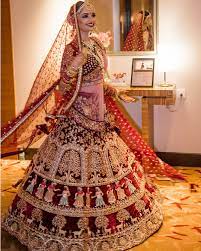 Maroon Bridal Lehenga With Exquisite Embroidery Intricated On It Picture Courtes Indian Wedding Dress Bridal Lehenga Bridal Lehenga Red Indian Wedding Gowns
