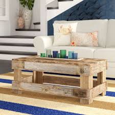 This handmade reclaimed wood coffee table has a unique, industrial design that will make it a striking addition to your home decor. Live Edge Coffee Tables You Ll Love In 2021 Wayfair