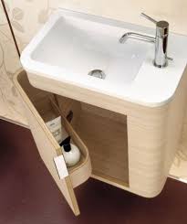 Building out a shallow shelf and tiling with plain white tiles not only hides waste pipes but also offers the perfect ledge for fresh foliage, bringing in pops of vibrant green to the scheme. Cool Way To Have Your Under Sink Cabinet Small Bathroom Vanities Small Bathroom Storage Small Bathroom