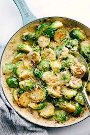 Creamy Parmesan Garlic Brussels Sprouts Are Sauteed In A Rich Thick And Creamy Parmesan Sauce Wi Sprout Recipes Garlic Brussel Sprouts Brussels Sprouts Recipe
