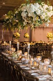 Romantic Rustic Chic Wedding At A Whiskey Distillery In Atlanta Inside Weddings Table Floral Arrangements Floral Chandelier Wedding Rustic Chic Wedding