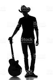 Cowboy Silhouette With Acoustic Guitar Guitar Photos Silhouette Photos Silhouette