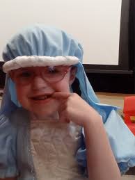 A young Dominic Baisas portraying Jesus in a town play during Holy Week.  Please identify the girl portraying the Virgin Mary.