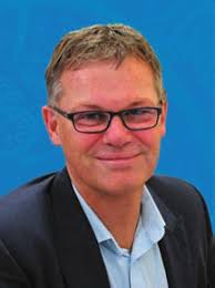 Retired Surgeon Bill Sugrue and former nurse of 50 years Helen Brown cut  the birthday cake