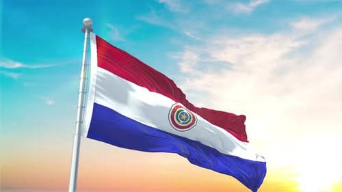 Fachada do prédio da Direção Nacional de Migrações do Paraguai com a bandeira do país ao fundo, representando a soberania nacional e as novas regras de fiscalização.