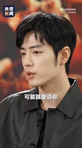 #Xiao Zhan Talks About Who Is The Greatest Hero# [#Xiao Zhan Says Serving  the Country and the People Is the Greatest Hero#], “I think a hero must  have a heart that serves the country and the people. ...