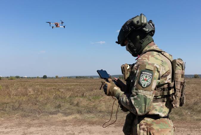 A Ukrainian military drone operator working on a mission in a undisclosed field.