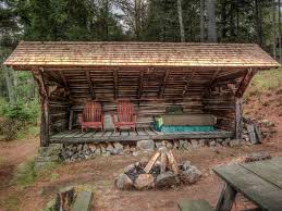 Rustic Landscape Yard With Fire Pit Deluxe Adirondack Chair Plywood Wrap Around Porch Outdoor Rustic Porch Backyard