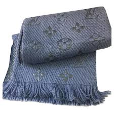 The denim logomania scarf uses twisted threads in two hues to craft a tonal color contrast. Louis Vuitton Logomania Scarf Blue Wool Ref 165753 Joli Closet