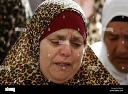 Relative mourns during funeral palestinian hi-res stock photography and  images