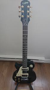 I bought a used 2013 epi les paul 100 from a professional musician and it was extremely well set up my real les paul never leaves the house so i wanted a guitar that felt, worked the same but i could take. Left Handed Epiphone Les Paul Lp 100 Black Mik Upgraded Reverb