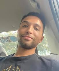 Visiting Chris's resting place with a small tree and ornament