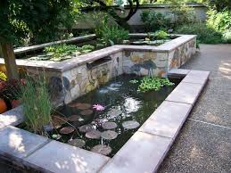 A Spillway Seperates These Two Ponds Aquatic Plants And Mosaics Soften The Rectolinear Design Wasserspiel Garten Hintergarten Wasser Im Garten