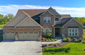 Exterior, house building type, brick siding material, and gable roofline. Blending Traditional Exteriors With Modern Trends James Hardie Pros