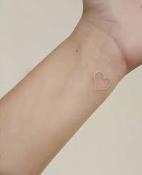 51 White Ink Tattoos That Will Inspire You To Get Inked Stayglam Skin Color Tattoos Small White Tattoos White Heart Tattoos