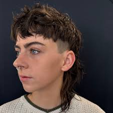 🔥 Mullet vibes we're serving — cut by Madi and caps energy all around!  This style is loud, proud, and ready to pop. You know what they say:  “Business in the front,