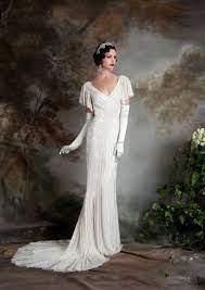 These 1920 wedding dress silhouettes also comply well with other bridal fashion history heavily embellished and finished with a feather trim this is a shorter length tulle vintage inspired gatsby wedding dress from jenny packham s 2020. 20 Art Deco Wedding Dress With Gatsby Glamour Chic Vintage Brides