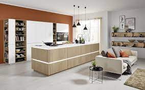 Looking for a good deal on kitchen sofa? Wooden Kitchen Island With Tall White Cabinets Nolte Kuechen Com