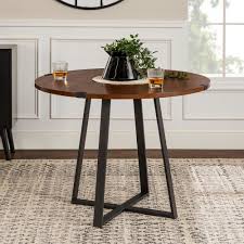 The oscuro dining table features natural wood grain juxtaposed against brushed metal for a modern feel. Walker Edison Furniture Company 40 In Rustic Round Dark Walnut Black Dining Table Hdw40rdwradw The Home Depot