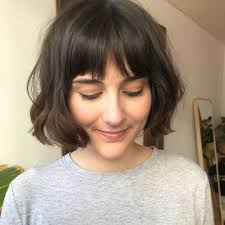 The round bob cut can be styled into many different looks and you can even wear it with a pretty dress for a formal occasion. This 90s Bob Is The Haircut You Need To Shake Up Your Winter Look This Year Hair Styles Short Hair With Bangs Short Hair Styles