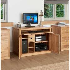 In a modern home office setting, computer desks are the most practical and utilitarian of all home office desks. Solid Light Oak Hidden Home Office Computer Desk Storage Cupboard Work Station