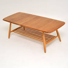 Vintage ercol coffee table with magazine rack no. 1960 S Vintage Ercol Coffee Table In Elm Retrospective Interiors Retro Furniture Vintage Mid Century Furniture Vintage Danish Modern Furniture Antique Furniture London