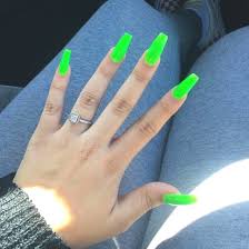 Create a neon nail outline by joining up two half moon's, one starting from the top and one starting from the bottom, with both meeting in the middle on one side. Summer Season Nail Art Designs