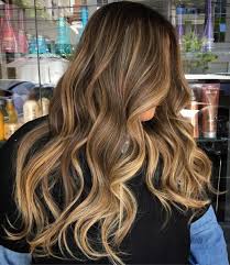 This is a marvelous color for the summer thanks to the strawberry blonde and caramel highlight. 20 Golden Brown Hair Color Ideas All Brunettes Need To See Golden Brown Hair Golden Brown Hair Color Brown Blonde Hair
