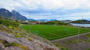 Small shops and galleries, great characteristic fishing village and still a vibrant town. This Football Stadium In Henningsvaer Amusing Planet