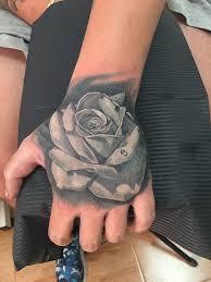 If you are looking for a hand tattoo, then try out this large rose tattoo. Rose Hand Tattoo Tattooartestudio Com
