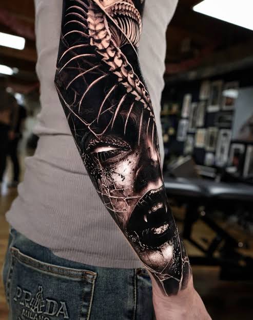 Dark surrealism by @rudyfoytattoos A haunting, fragmented face ...