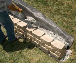 We Ll Show You How To Build A Strong Stylish Retaining Wall Without Mortar Landscaping Retaining Walls Retaining Wall Patio Backyard Retaining Walls
