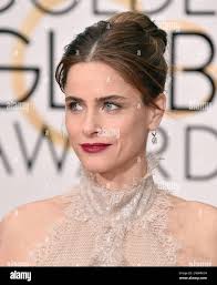 Amanda Peet arrives at the 73rd annual Golden Globe Awards