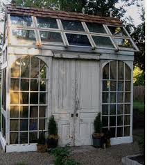garden glasshouse made entirely and cleverly out of recycled doors and windows greenhouse shed diy greenhouse recycled door
