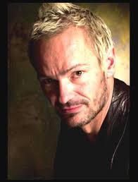 Vince White, born in 1960 in the United Kingdom, is best known for his role  as a guitarist for The Clash during the band's final years. His time with  the group, while