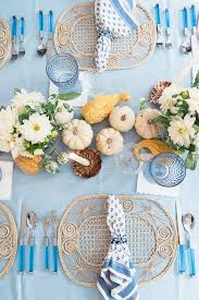 The rustic texture of the wooden table makes crisp blue and white napkins pop. Blue And White Thanksgiving Table Ideas Darling Down South