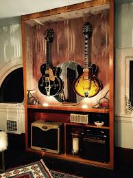 The guitar is made of wood with metal strings and accents creating a rustic and industrial look. Music Room 3 Home Music Rooms Music Studio Room Music Room Design