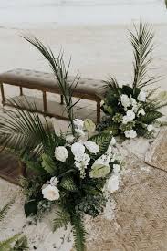 White flowers are a traditional floral choice for a wedding. 20 Stunning Beach Wedding Ceremony Ideas Backdrops Arches And Aisles Emmalovesweddings Wedding Beach Ceremony Beach Wedding Flowers Beach Wedding Decorations Reception