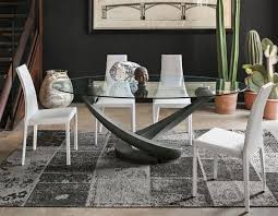 Glass dining tables a modern glass dining table helps make a smaller dining room feel bigger and is a great solution for highlighting a statement area rug placed beneath the table. Target Point Contemporary Tango Glass Oval Dining Table Oval Table Dining Dining Room Design Modern Glass Dining Table