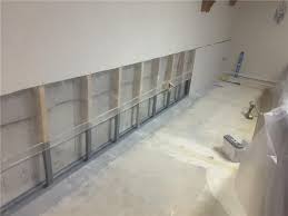 Wood and drywall have a lot of pros in comparison to precast concrete. Woods Basement Systems Inc Basement Waterproofing Photo Album Waterguard Behind A Finished Wall