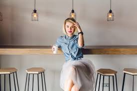 Blonde hair shades ash blonde hair icy blonde white blonde blonde color blonde highlights white hair majirel coffee blonde hair shades! Free Photo Dreamy Stylish Girl With Blonde Hair And Pink Lips Sitting In A Coffee Shop With Wooden Chairs And Table She Holds A Cup Of Cofee And Touches Her Hair