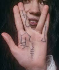 If you like grime tattoo, you might love these ideas. Grimes Musician 16 Tattoos Their Meanings Body Art Guru