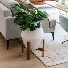 The eclectic assortment of furniture, bed linens. Ilya Turned Wood Planters White