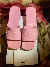 Hone your styling chops by wearing a formerly forbidden, socks with sandals combination that guarantees you'll stand out from the crowd. Gucci Rubber Logo Platform Slide Sandal
