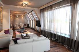 For cathedral ceilings, leave approximately four to six inches above the window trim as a guideline. 4 Creative Ways To Hang Curtains