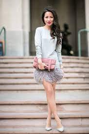 20 Gorgeous Winter Wedding Guest Style Ideas Pretty Tulle Skirts Statement Dresses And More Wedpics Blog Feather Dress Wedding Guest Outfit Winter Feather Outfit